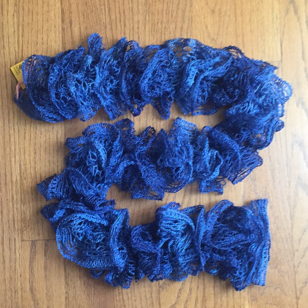 Shimmering cobalt twirled lace scarf.